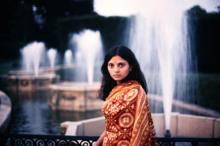 Sumi is in focus and the fountains